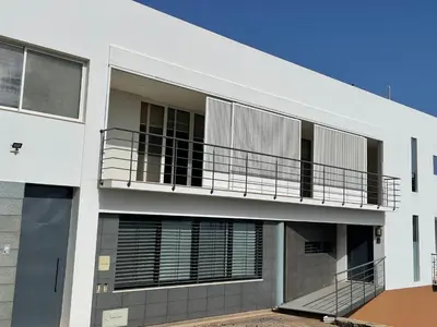 a white building with a balcony on it at Marimar in Praia