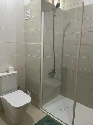 a bathroom with a shower with a toilet at Marimar in Praia