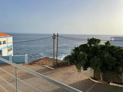 a view of the ocean from a balcony of a building at Marimar in Praia