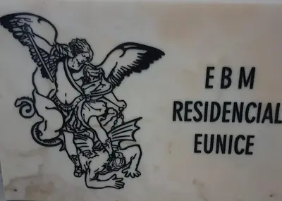 a drawing of an angel on a white sign at Chambre 3 Residencial Eunice in Praia