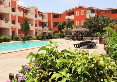 a resort with a swimming pool and some buildings at Sunshine home Sal in Santa Maria