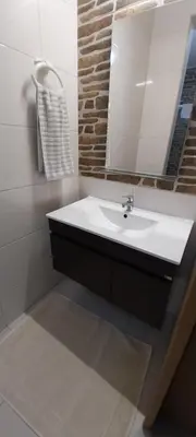 a bathroom with a sink and a mirror at Ca’ Tina in Santa Maria