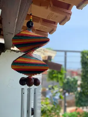 a colorful towel hanging from a porch at Quarto Nº7 FAMILIA VEIGA - Central Praia in Praia