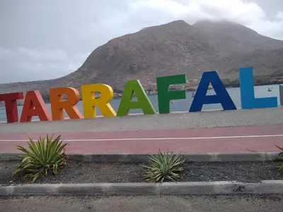 a sign with the words harah in front of a mountain at Praia Center in Praia