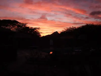 a sunset with the sun setting in the sky at Villa Morabeza Guest House in Mindelo