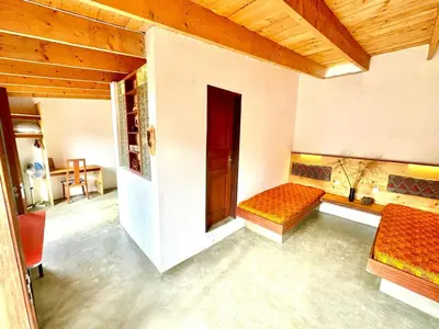 a room with a couch and a bed in it at Villa Morabeza Guest House in Mindelo