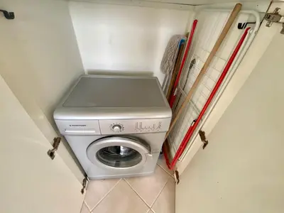 a washer and dryer in a small room at Leme Bedje Three bedroom - By Bobbywashere in Santa Maria