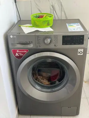 a washing machine with a basket on top of it at PIMONTAPARTMENTS in Espargos