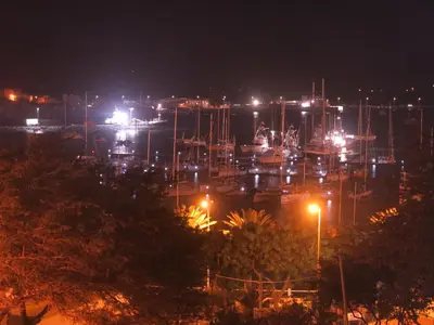 a view of a harbor at night with lights at Casa de Nômades Digitais in Mindelo