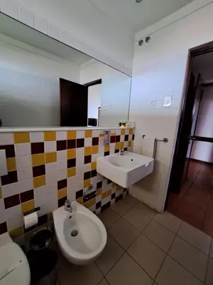 a bathroom with a sink and a toilet at Bamboo Xaguate Hotel in São Filipe