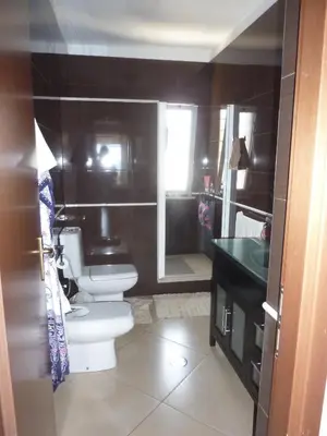a bathroom with two toilets and a sink at Villa Halcyon cabo verde close to the beach in Cidade Velha