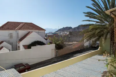 a view from the balcony of a house with a palm tree at Casa Matnik in Mindelo