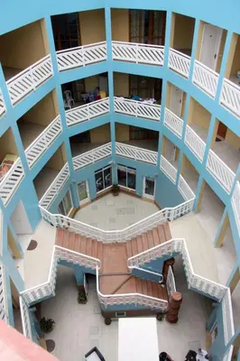 an overhead view of an apartment building with blue balconies at Residence Estrela do Mar in Sal Rei