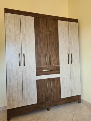 a large wooden cabinet in a room at Plaza Top floor apartment in Santa Maria