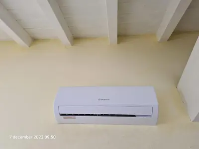 a white printer sitting on a floor in a room at Plaza Top floor apartment in Santa Maria
