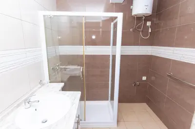 a bathroom with a shower and a sink at Studio Maya Mindelo in Mindelo