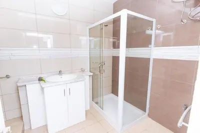 a bathroom with a shower and a sink at Studio Maya Mindelo in Mindelo
