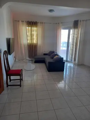 a living room with a couch and a chair at CHEZ LU & LUCIO in Assomada