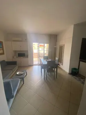 a living room with a couch and a table at MORADIAS I02/C in Prainha