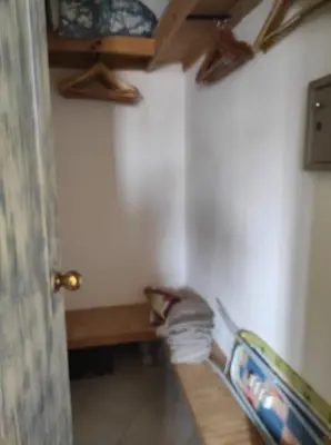 a hallway with a room with a bed and a ceiling at Holiday Properties Casa Laranja in Santa Maria