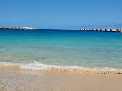 a beach with a pier in the water at Relaxing Blue Flat near beach! in Calheta Do Maio