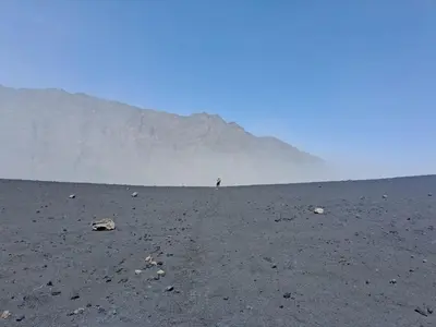 a person standing in the middle of a desert at Rose silva in Portela