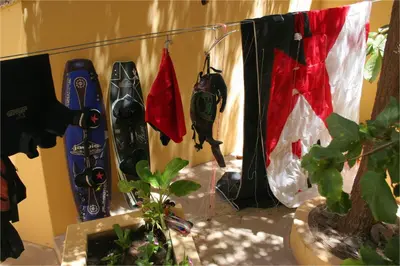 a group of snowboards are hanging on a wall at Solar Windelo in Mindelo