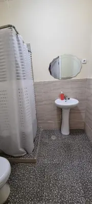 a bathroom with a shower and a sink and a mirror at Recanto da Montanha in Rui Vaz