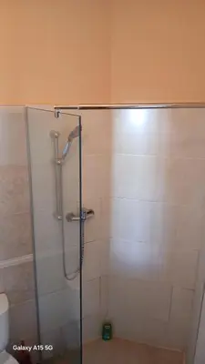 a shower with a glass door in a bathroom at Beach Villa am Praia de Chaves, Boa Vista, Cabo Verde in Boa Ventura