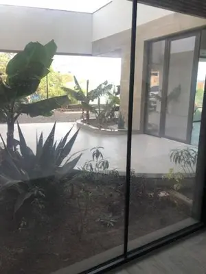 a view of a courtyard with plants in a building at Apartamento Deluxe Santa Filomena in Mindelo