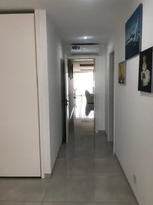 a hallway with a door leading to a hallway with a hallwayngthngthngthngth at Apartamento Deluxe Santa Filomena in Mindelo