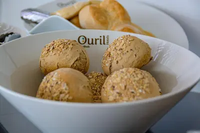 a white bowl filled with balls of food on a table at Ouril Mindelo in Mindelo