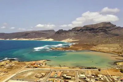 an aerial view of a beach with mountains in the background at Djon’s place in Baia das Gatas