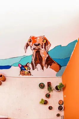 a painting of a dog on the side of a wall at Villa PalMarina in Praia
