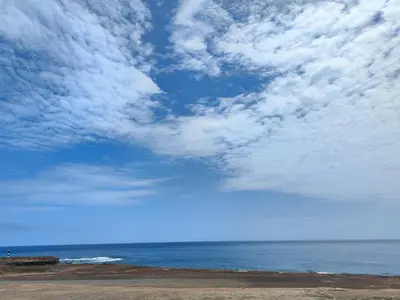 a blue sky with clouds over the ocean at Casa Andrade Delgado - Rocha Grande in Ponta do Sol