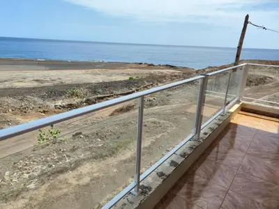 a balcony with a view of the ocean at Casa Andrade Delgado - Rocha Grande in Ponta do Sol