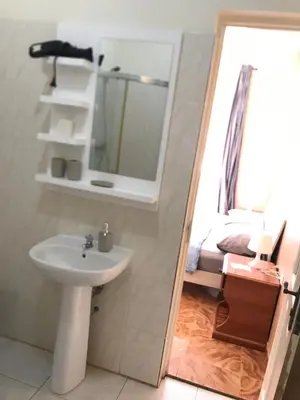 a bathroom with a sink and a mirror at Casa Andrade Delgado - Rocha Grande in Ponta do Sol