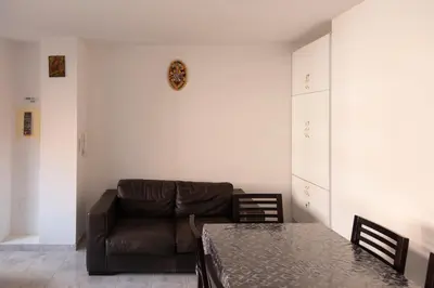 a living room with a couch and a table at 3 bdr cozy apt in Condominio Mi, Palmarejo Grande in Praia