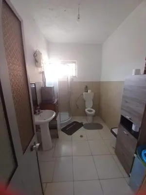 a small bathroom with a toilet and a sink at Casa Barreto in Tarrafal