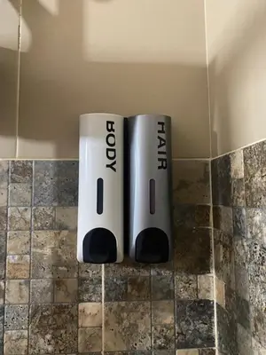 twointendo wii controllers sitting on top of a counter at Katila-Rooms in Santa Maria
