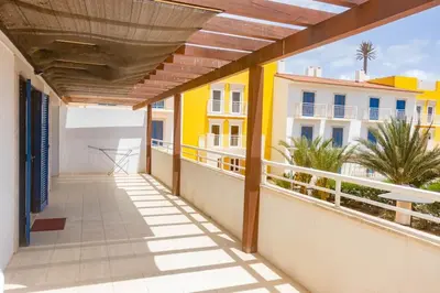 a balcony with a view of a building at Sol & Lar No stress in Santa Maria