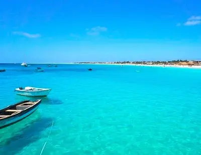 two boats sitting in the water in the ocean at Isla de Sal in Santa Maria