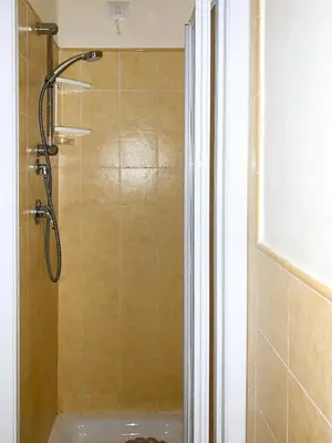 a shower in a bathroom with a glass door at Isla de Sal in Santa Maria