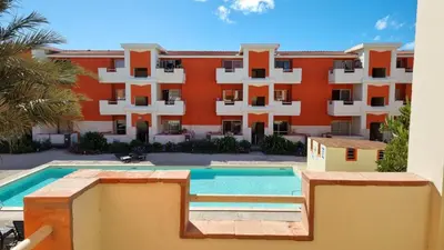 a building with a swimming pool in front of a building at Isla de Sal in Santa Maria
