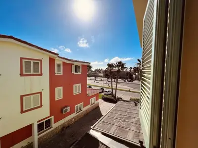 a view of a street from a window of a building at Cozy Apartment with Pool, near Beach and Center in Santa Maria