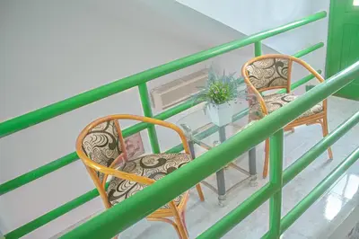 a balcony with two chairs and a glass table at Vila Paradise Sea & Swimming Pool View in Beirona