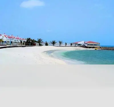 a view of a beach with houses and the water at Vila na Mágica Baía da Murdeira in Beirona