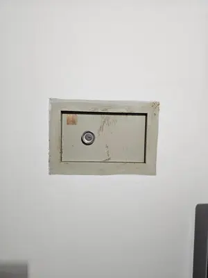 a lightswitch on a white wall in a room at Soleil Beach House in Santa Maria