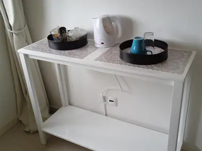 a white table with two dishes on top of it at chambre chez alcinda in Mindelo