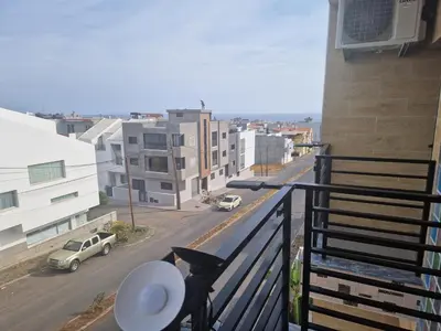 a balcony with a view of a city street at SUITES-HOME, CIDADELA in Praia